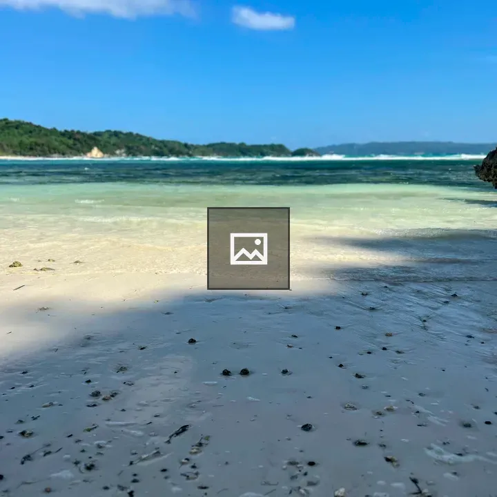 White Sand Beach with Green Hill