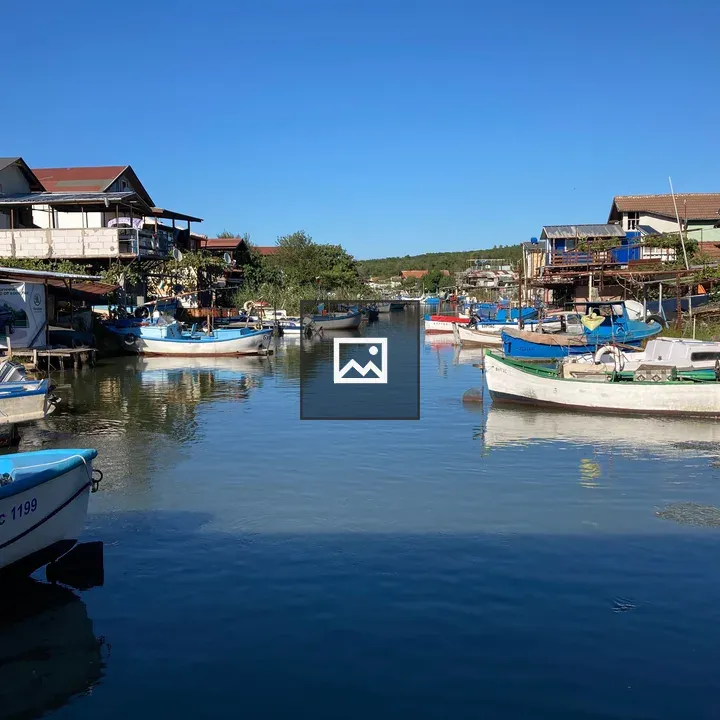 Waterfront canal with boats and buildings
