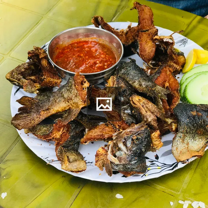 Fried trout with spicy sauce