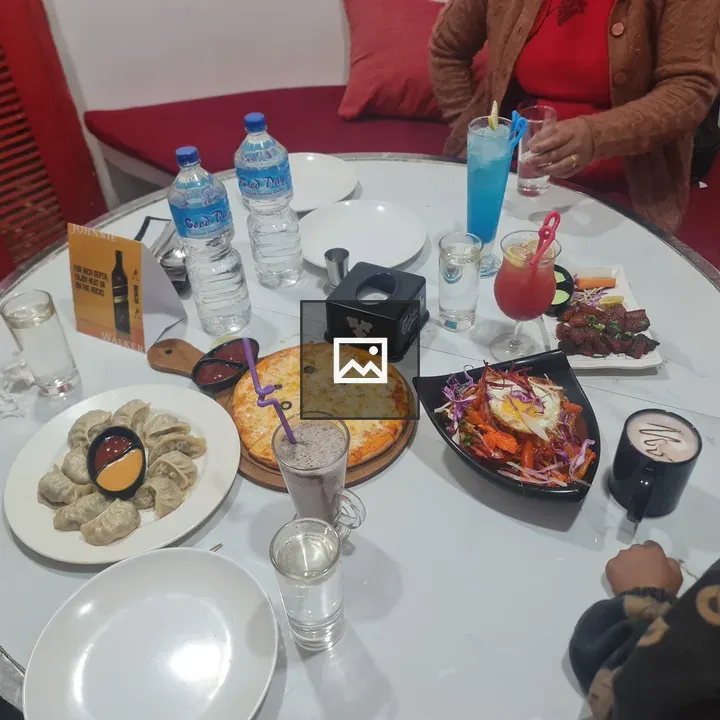 Pizza and beverages on table