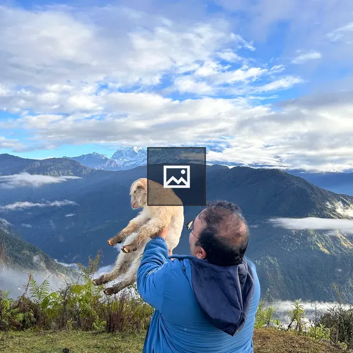 Man with blue jacket and golden retriever goat