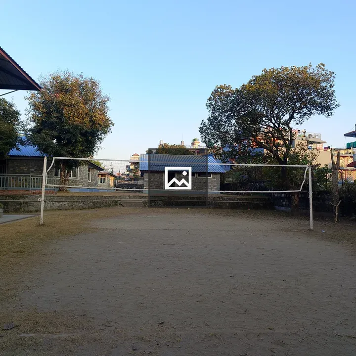 A sandy outdoor volleyball court