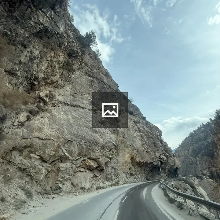 Winding road along rocky cliff