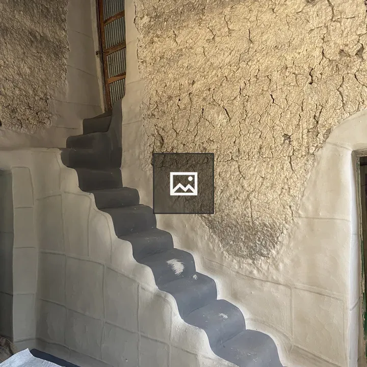 Steep staircase in rustic interior