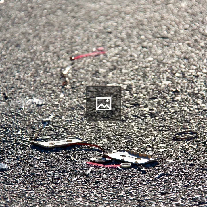 Broken cassette on road