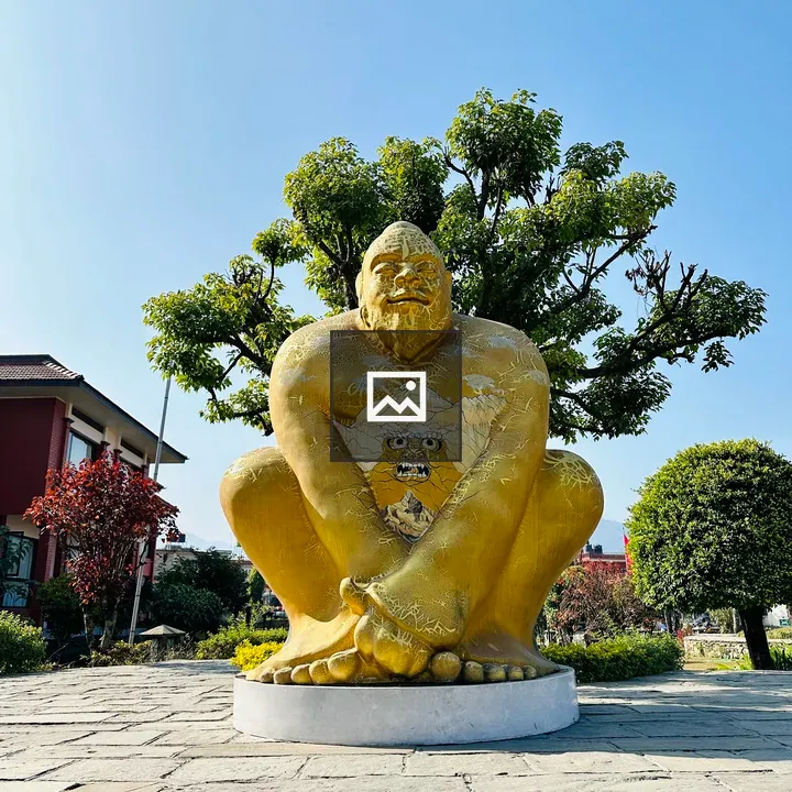 Yellow Statue of Burly Man