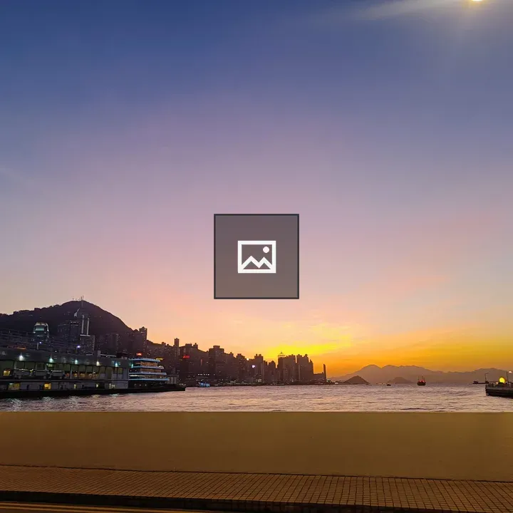 Waterfront cityscape at sunset