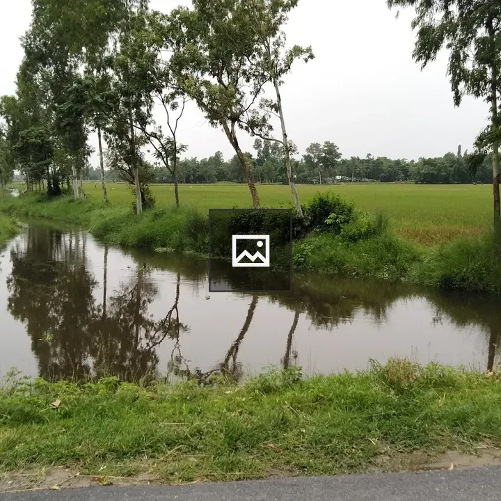 Small canal among rural fields