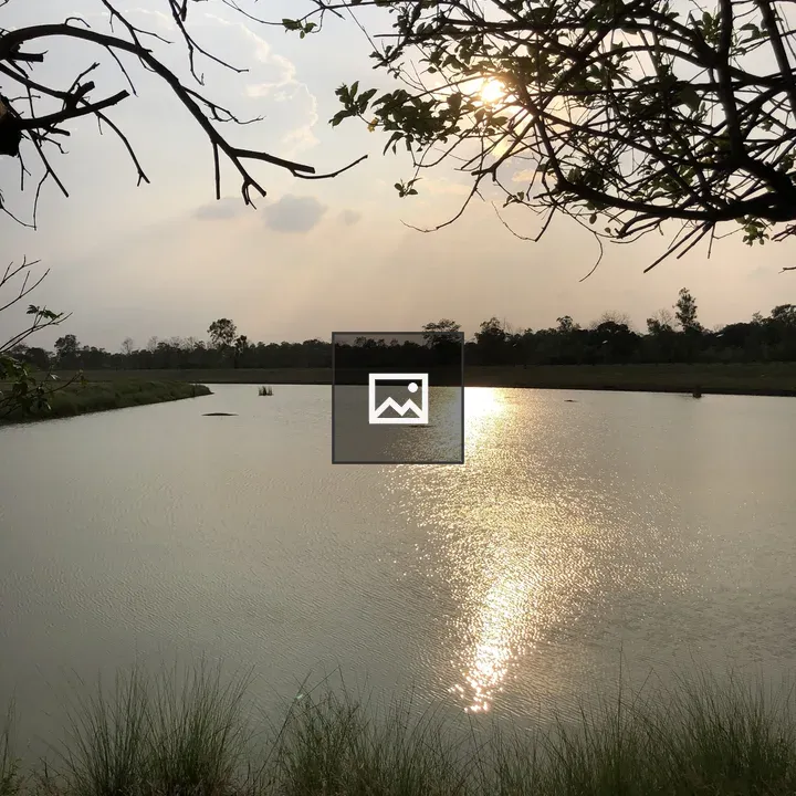 Serene lakeside sunset scene