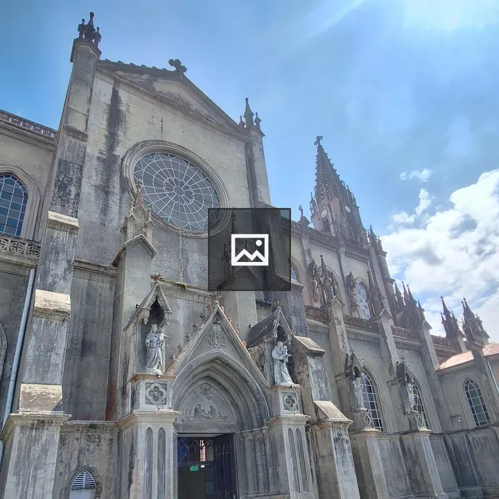Gothic church facade with round stained window