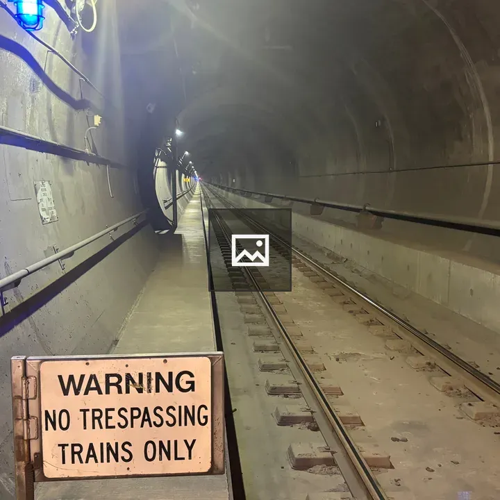 Subway Tube and Warning Sign