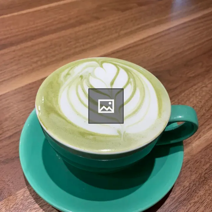 Hot matcha latte in cup