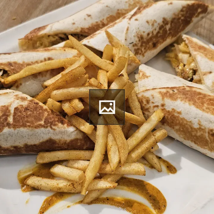 Plate of tortilla wraps with fries