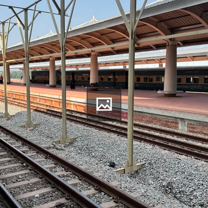 Train station platform with rails and carriages