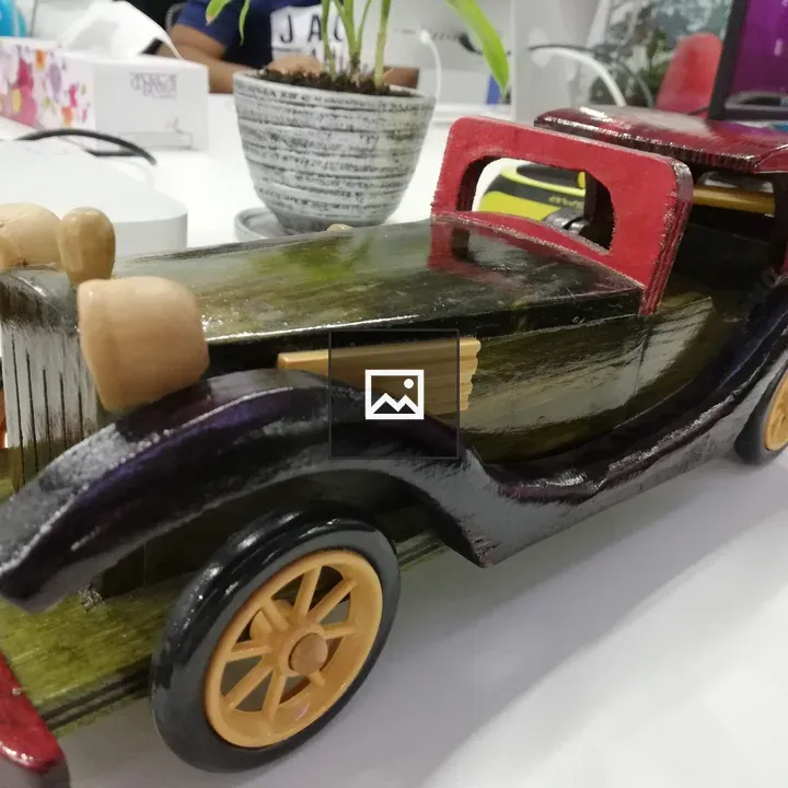 Car carved in wood