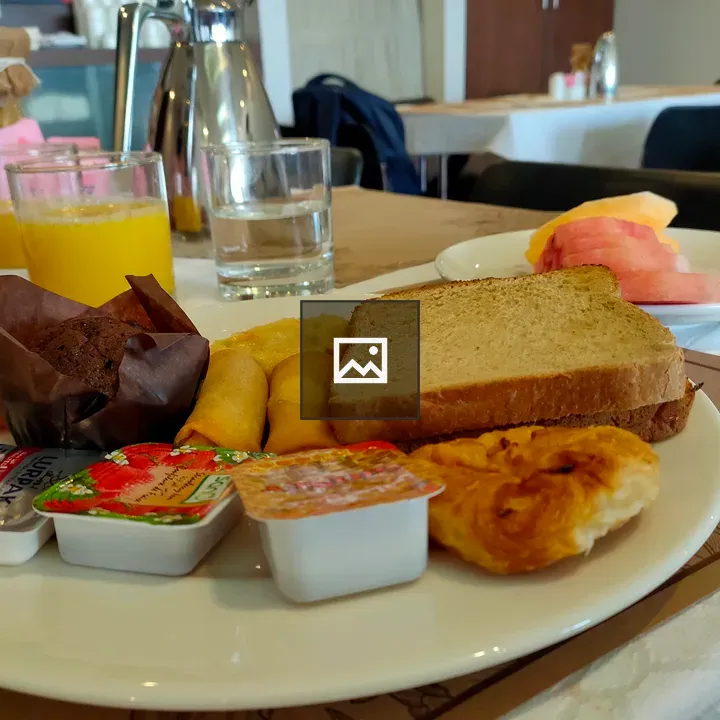 Breakfast spread with cake and fruits
