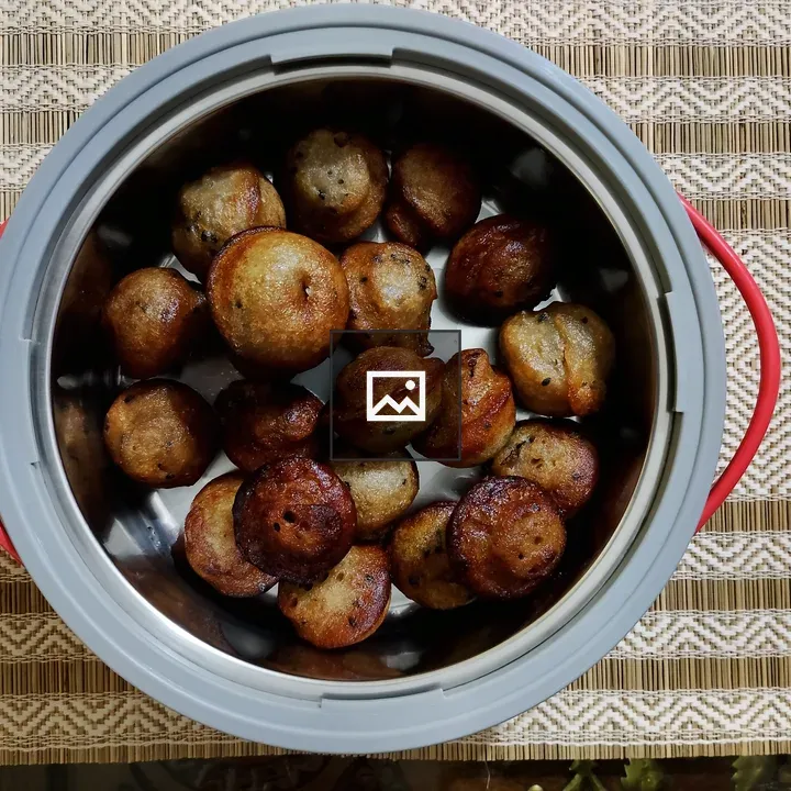 Round steel container with Unniyappam
