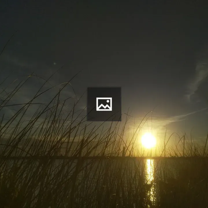 Sunset over lake and silhouette