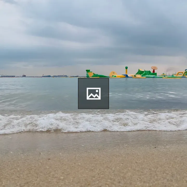 Cloudy Beach With Water Attractions