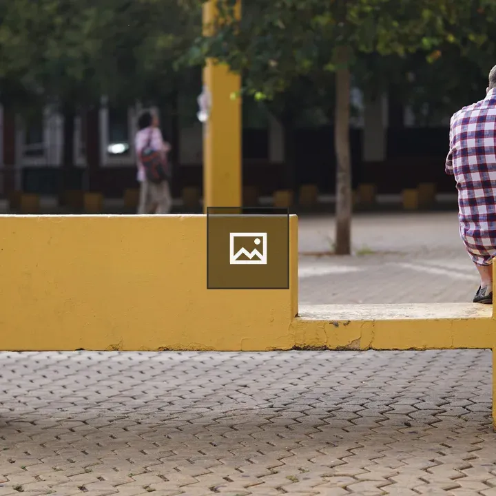 Man on Yellow Bench Outdoor