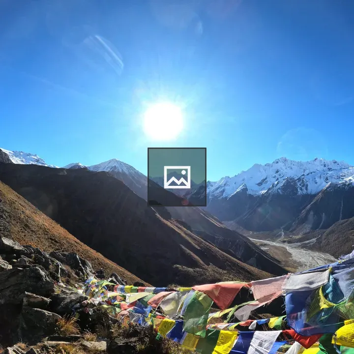 Sunrise summit with prayer flags