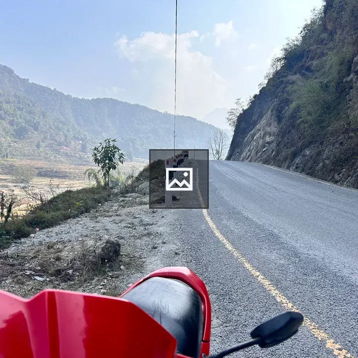 Red scooter by the road
