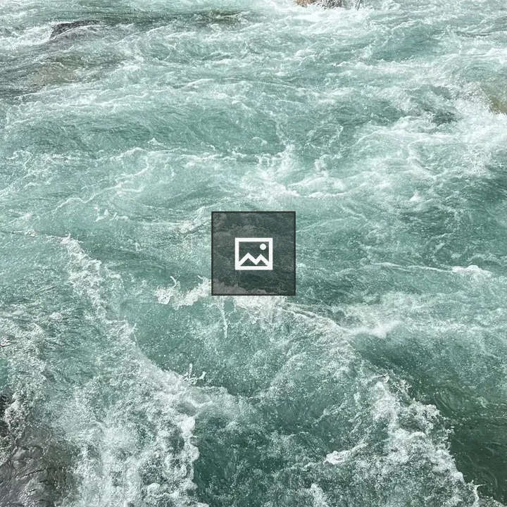 Turquoise River Flowing Over Rocks