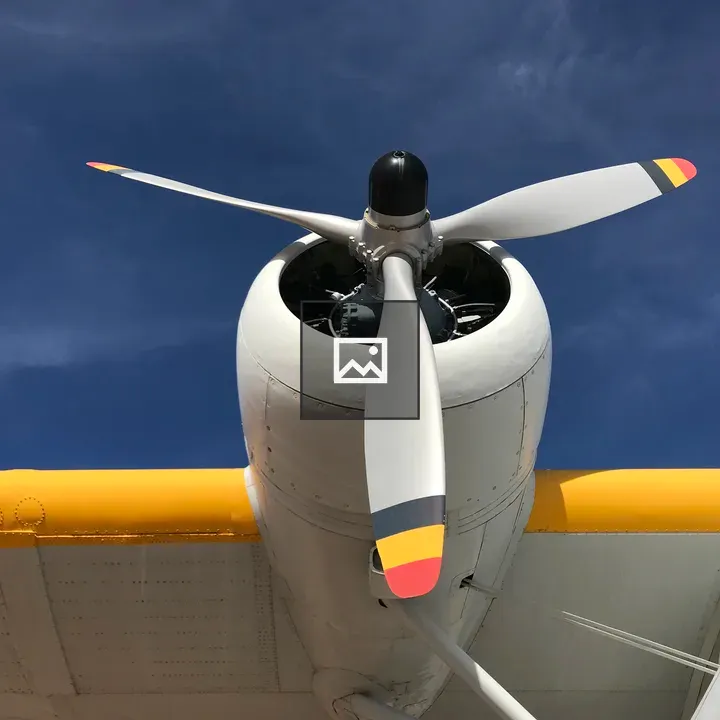 Airplane propeller against blue sky