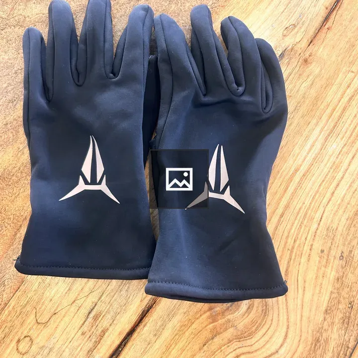 Pair of Black Gloves on Wood