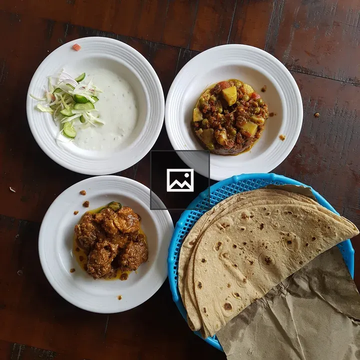 Wooden Table with Plates and Flatbreads