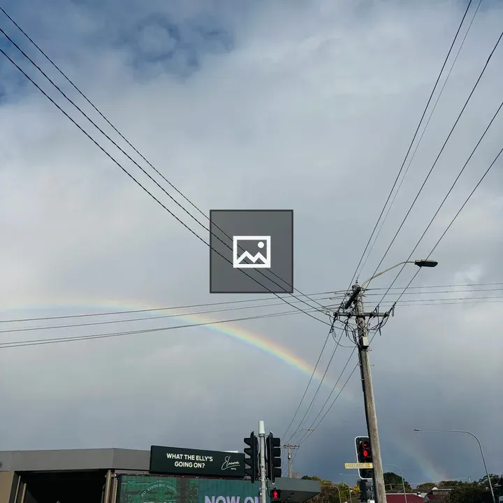 Rainbow over City Skyline