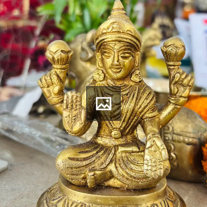 Golden deity statue with four arms