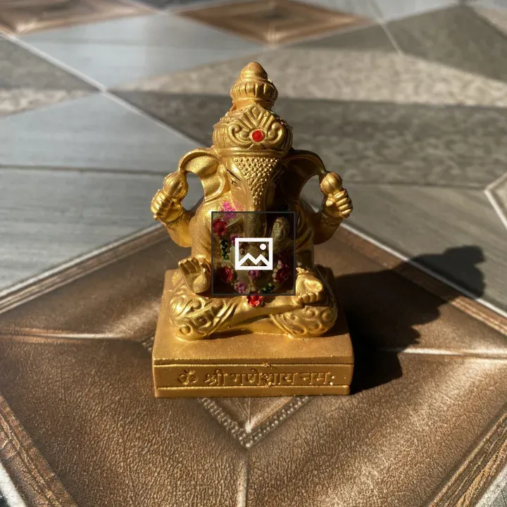 Ganesha statue in gold-toned detailing