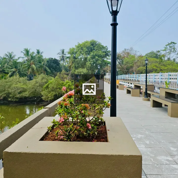 Lamps and Benches by River Walkway