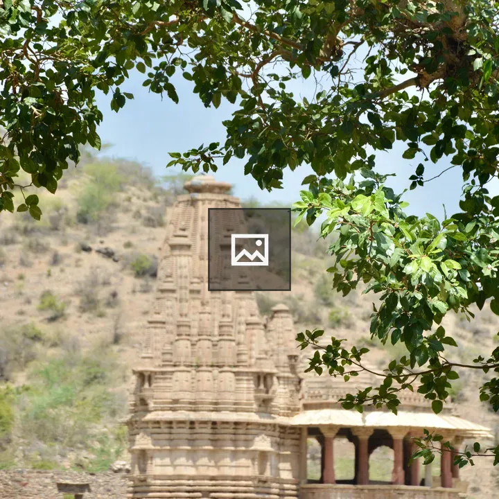 Temple Framed by Green Leaves