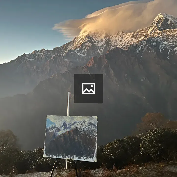 Artwork on Easel with Mountain Sunrise