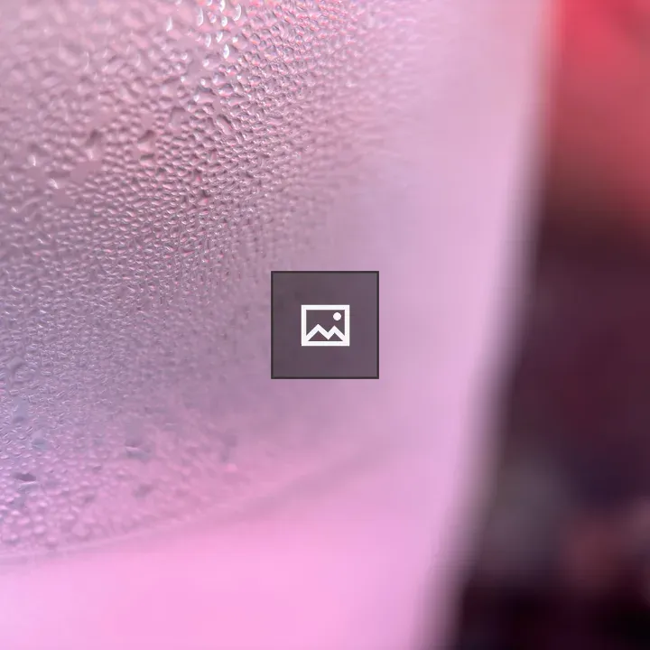 Closeup of water beads on a glass