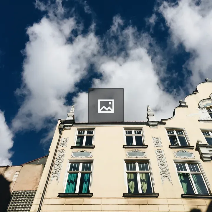 Facade with blue sky and clouds in Wrocław