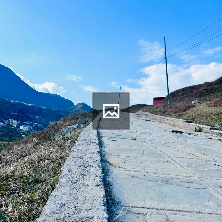 Grassy hill with walking trail
