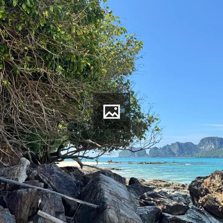 Beach scene with rocks and island