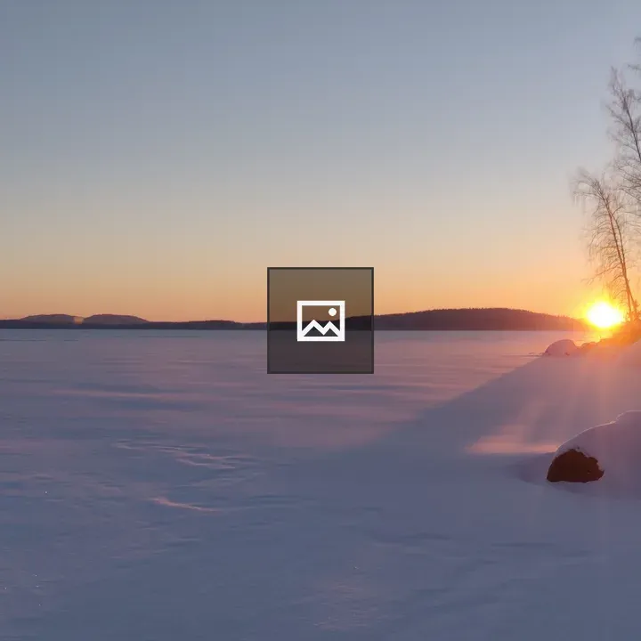 Sunset over frozen lake