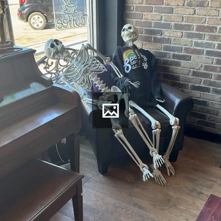 Two Skeletons in a Chair