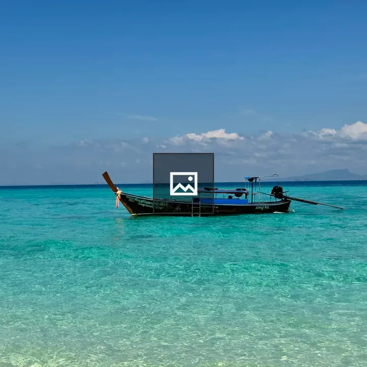 Wooden longtail boat on turquoise water
