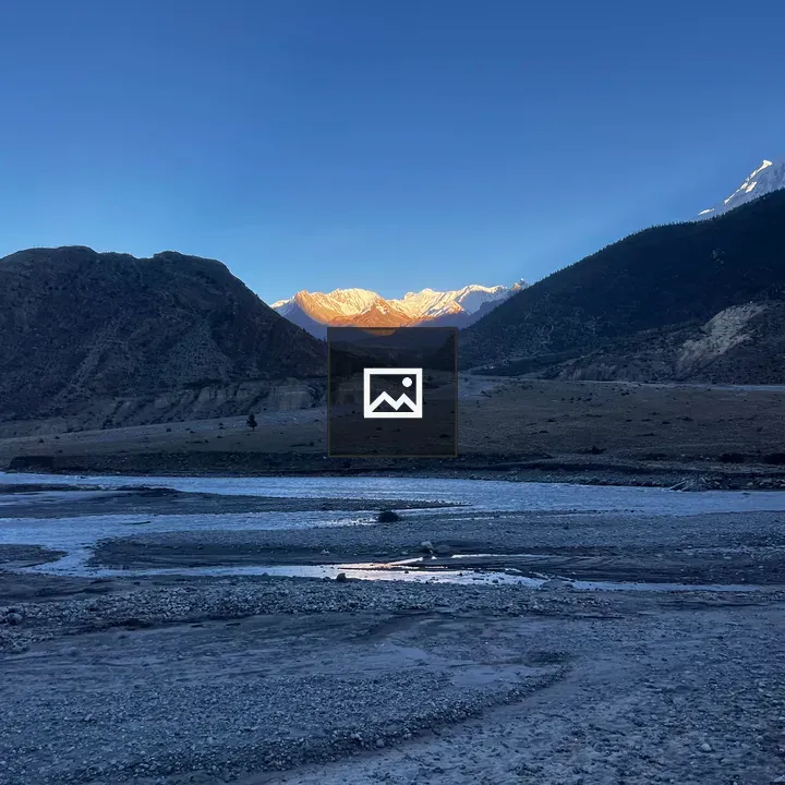 Rocky Riverbed to Snow Peaks