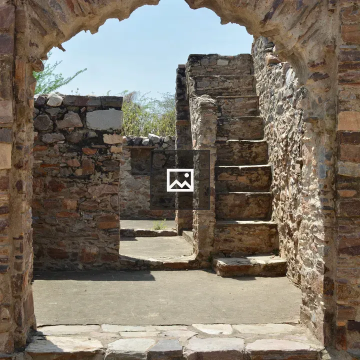 Small arched window in ancient Bhangarh walls