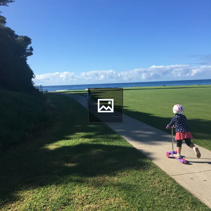 Child on Scooter in Park