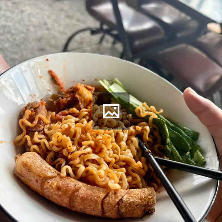 Close-up Noodle Bowl with Sausage and Bok Choy