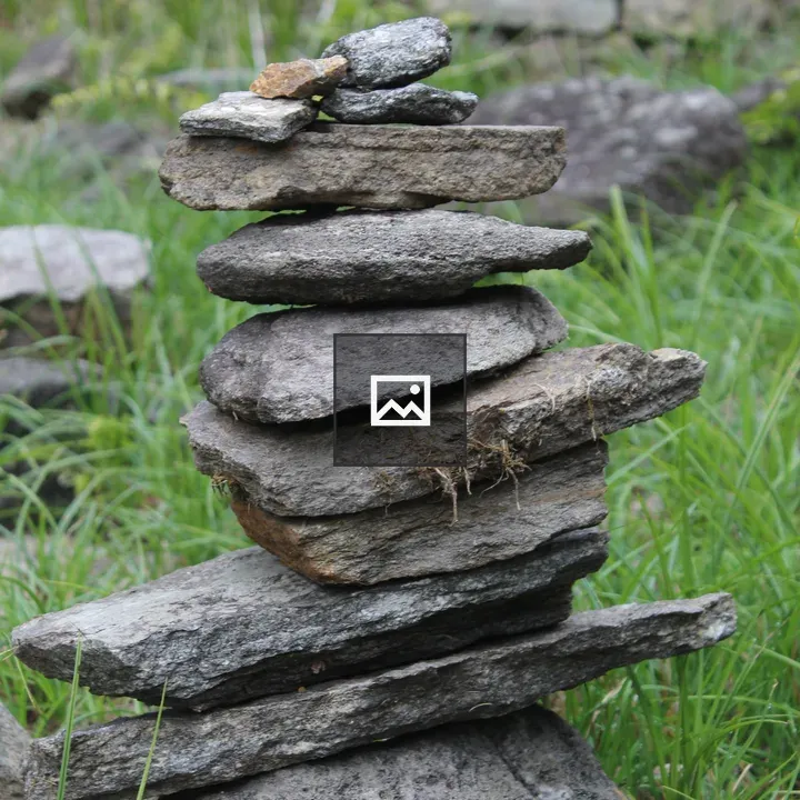 Stacked Stones on Grass