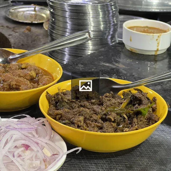 Two yellow bowls with spiced meat