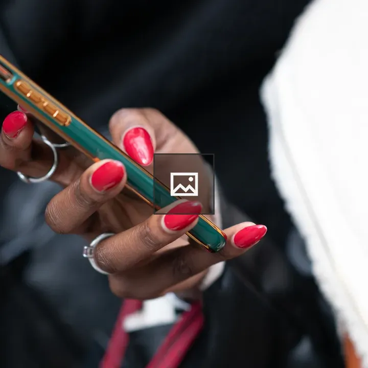 Black female hand with red nails